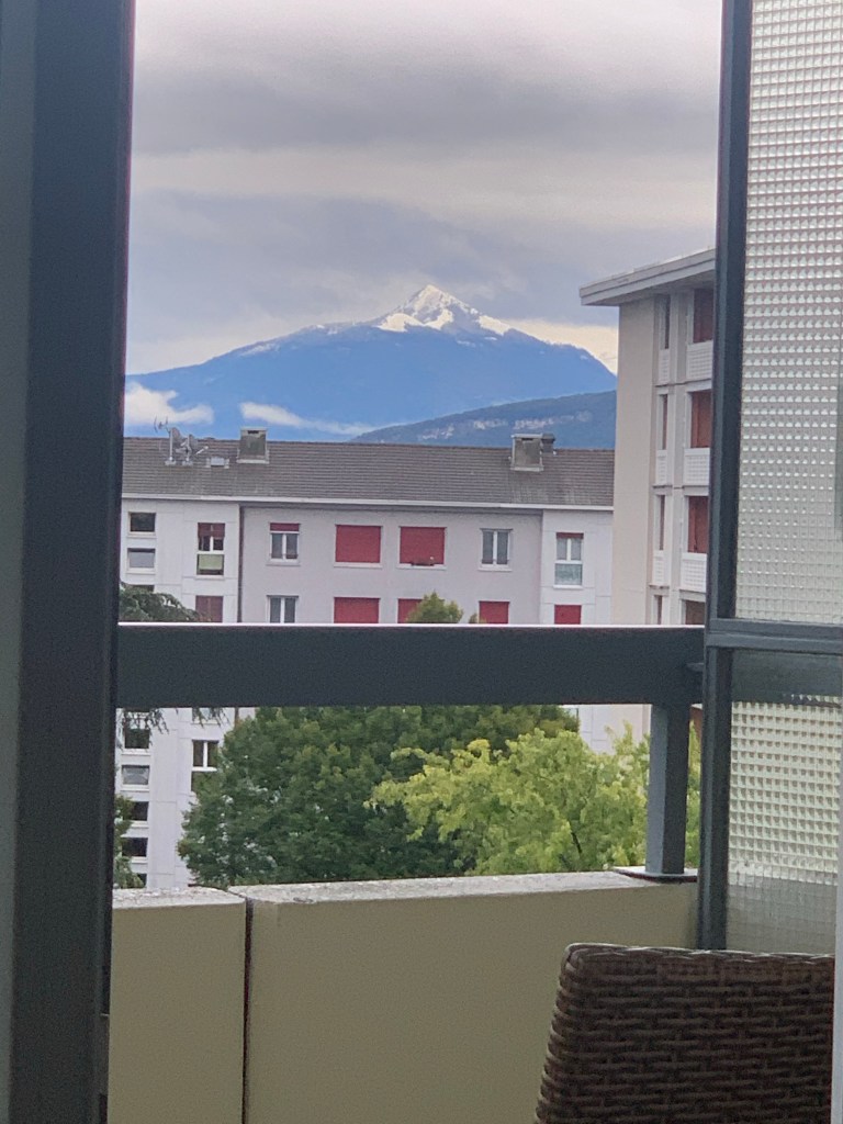 The view of a mountain from a balcony .